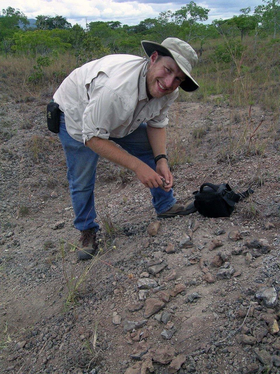 Sterling Nesbitt, assistant professor of geological sciences at Virginia Tech, collects bones in Tanzania from his discovery of the reptile Nundasuchus songeanensis in 2007. (Photo by Dr. Roger Smith, Iziko Museum, South Africa)