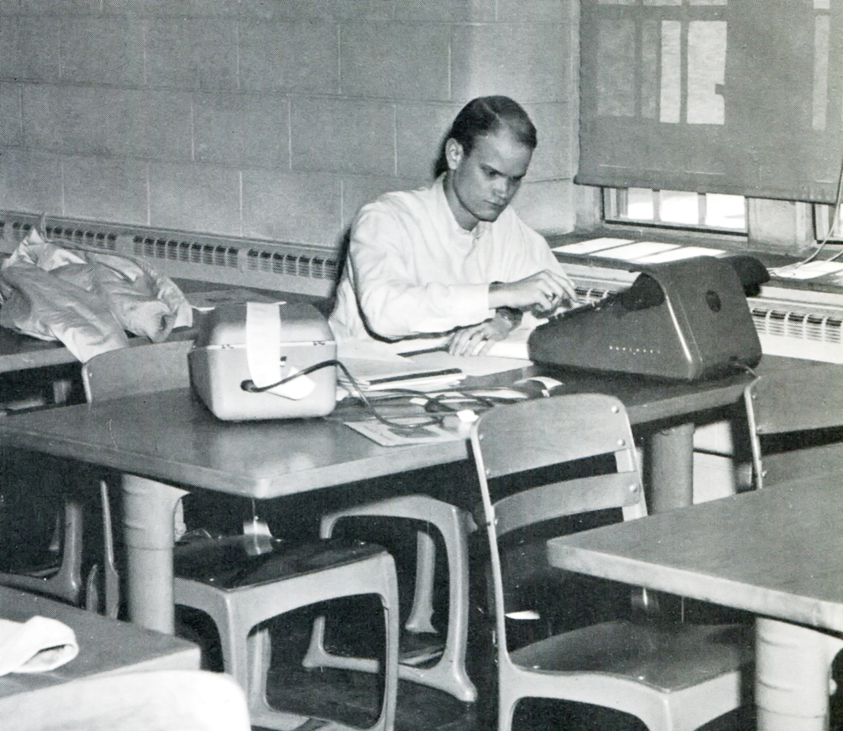 A business student at what was then Virginia Polytechnic Institute works on an assignment.