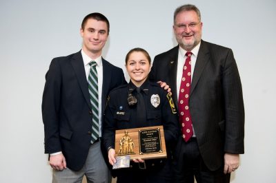 Virginia Tech police officer Kendrah Cline with Virginia Tech student Michael Senoyuit IV and his father Michael Senoyuit III.