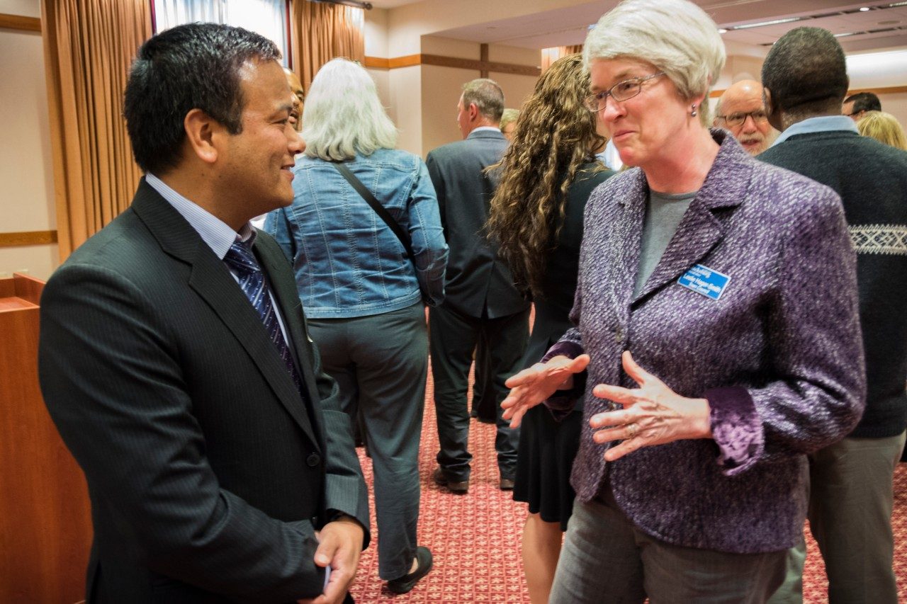 Khim Ghale, a journalist from Nepal, talks with Blacksburg Councilwoman Leslie Hager-Smith during a reception for the Humphrey Fellows at The Inn at Virginia Tech and Skelton Conference Center.
