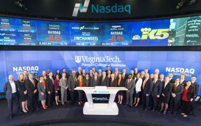 President Sands, Dean Sumichrast, and various Pamplin alumni, members of the Pamplin Advisory Council, students, and college representatives posed at the Nasdaq MarketSite broadcasting studio.