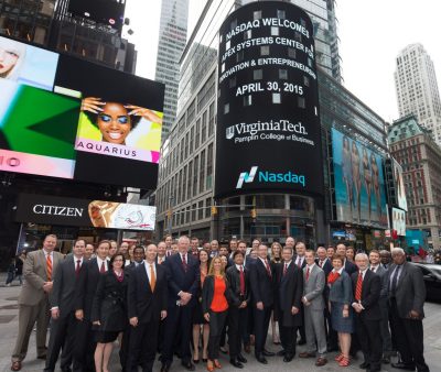 The Virginia Tech visitors pose in front of MarketSite’s display tower in Times Square.