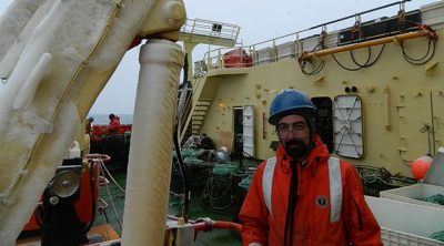 Iskander Ismailov, an assistant research professor at the Virginia Tech Carilion Research Institute, on the deck of a research vessel in the Southern Ocean. Note the ice on the exposed surface of the ship. 