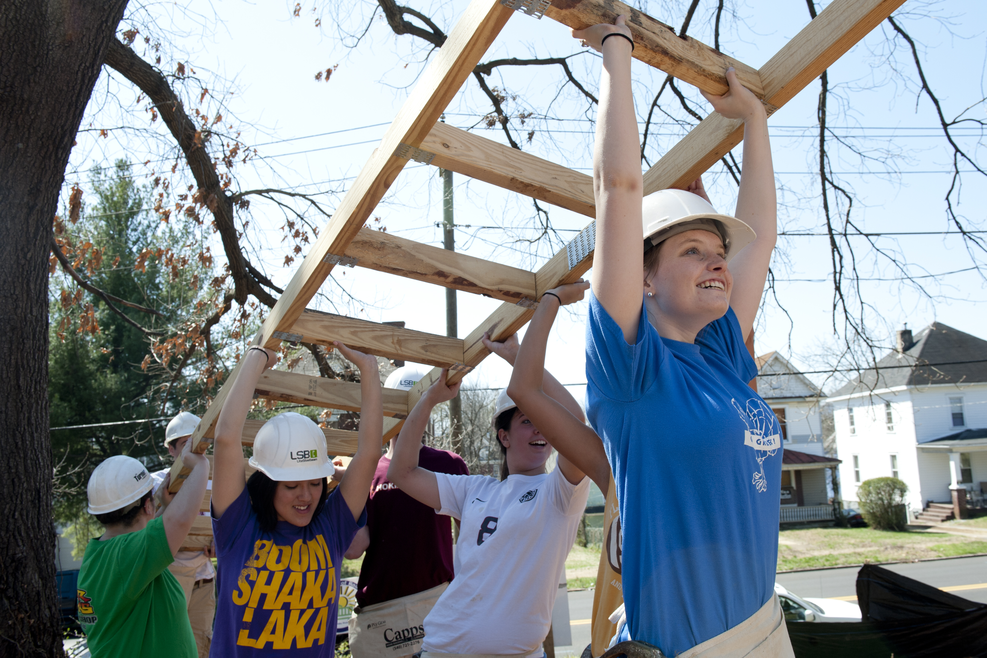 A group of students help to build a home through Habitat for Humanity