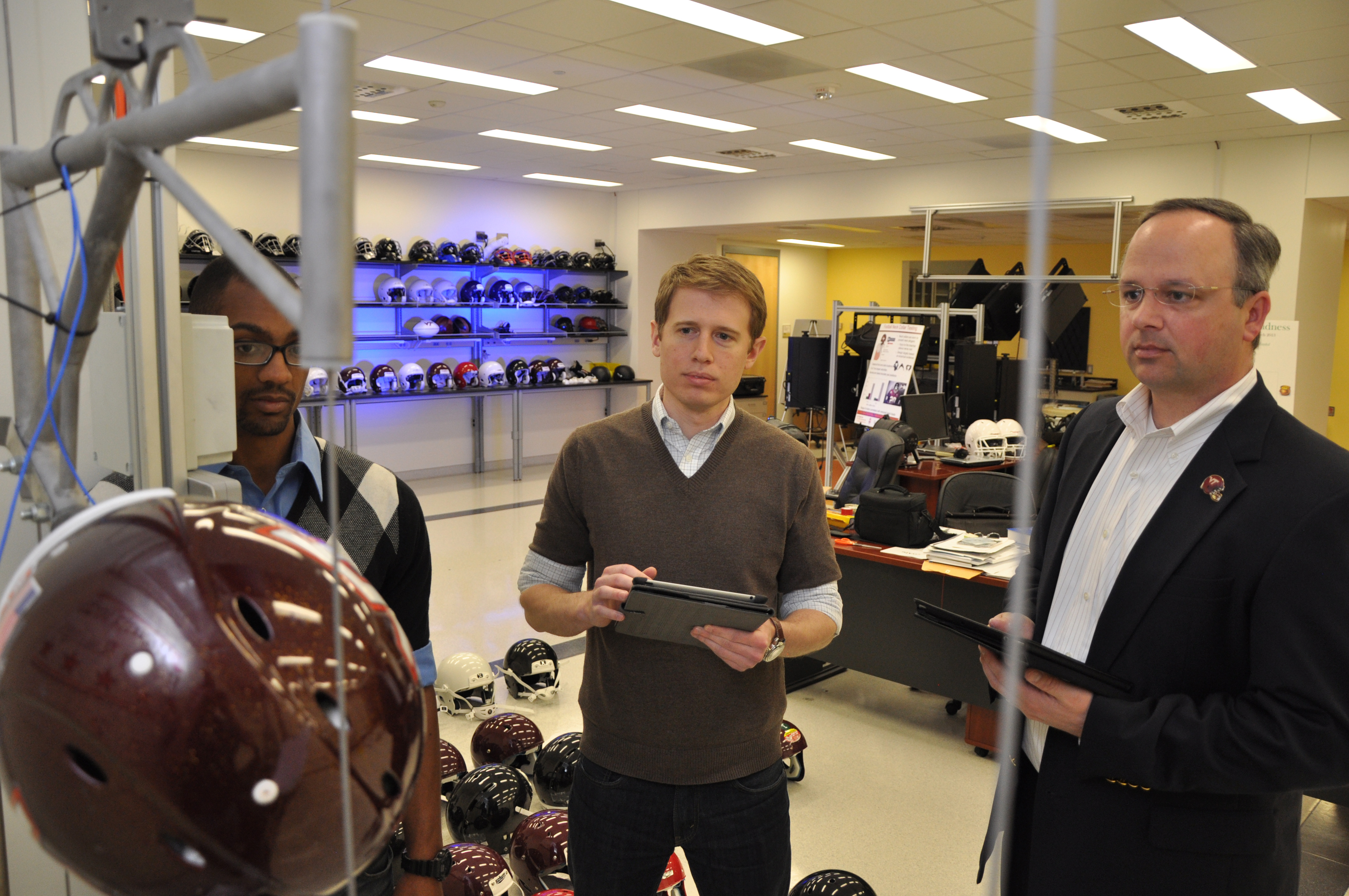 Steve Rowson and Stefan Duma inside the Virginia Tech helmet lab