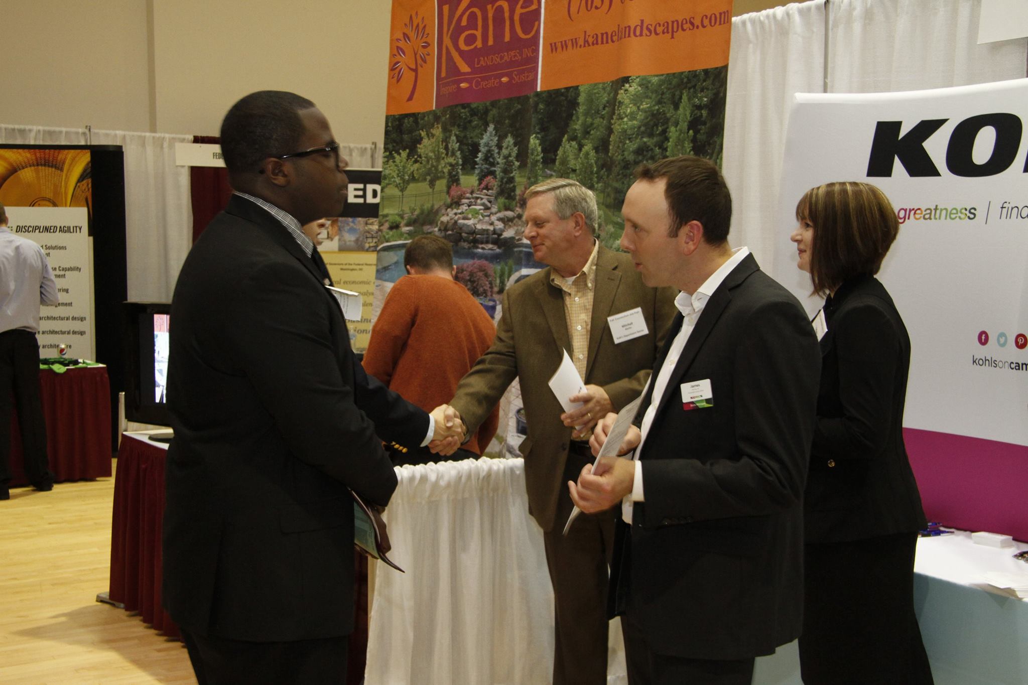 Students gather in Squires for a job fair. Students speak with employers.