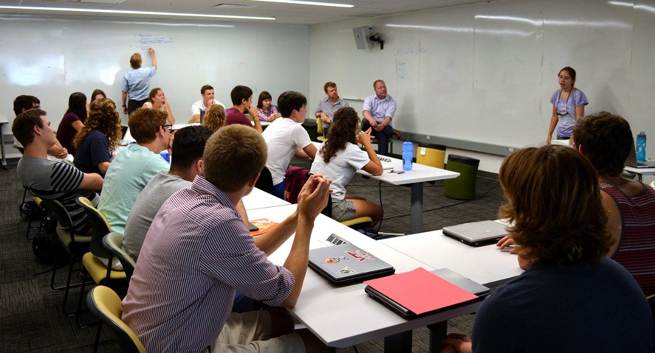 Entrepreneurial-minded students associated with the Apex Systems Center discuss ideas during "startup class." They take ideas for new businesses or products and brainstorm in a hands-on, team-oriented setting. 