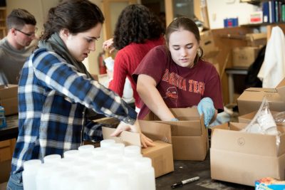 Students work to assemble water test kits that will be sent to Flint, Michigan, residents.