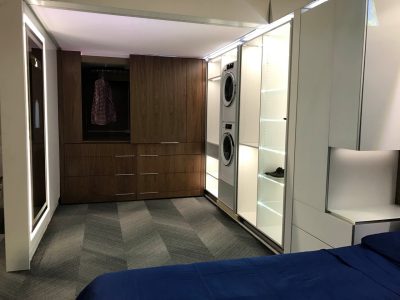 The smart wardrobe and closet expand to reveal a dressing room and laundry area.