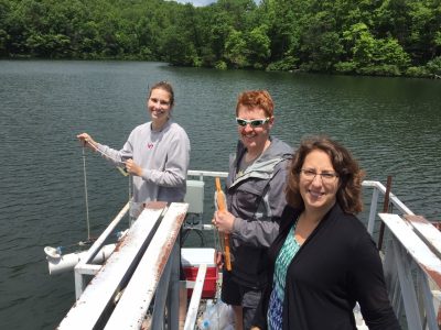Madeline Schreiber, a professor of geosciences in the College of Science (far right) visits Falling Creek reservoir with undergraduate Katie Krueger of Asheville, NC and former graduate student Zack Munger.