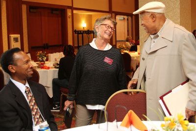 Sylvester Johnson, Karen Depauw, and Randy Grayson share a laugh during the networking lunch. 