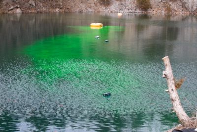 Dye tracking experiment at the quarry pond. Photo credit: Peter Means 