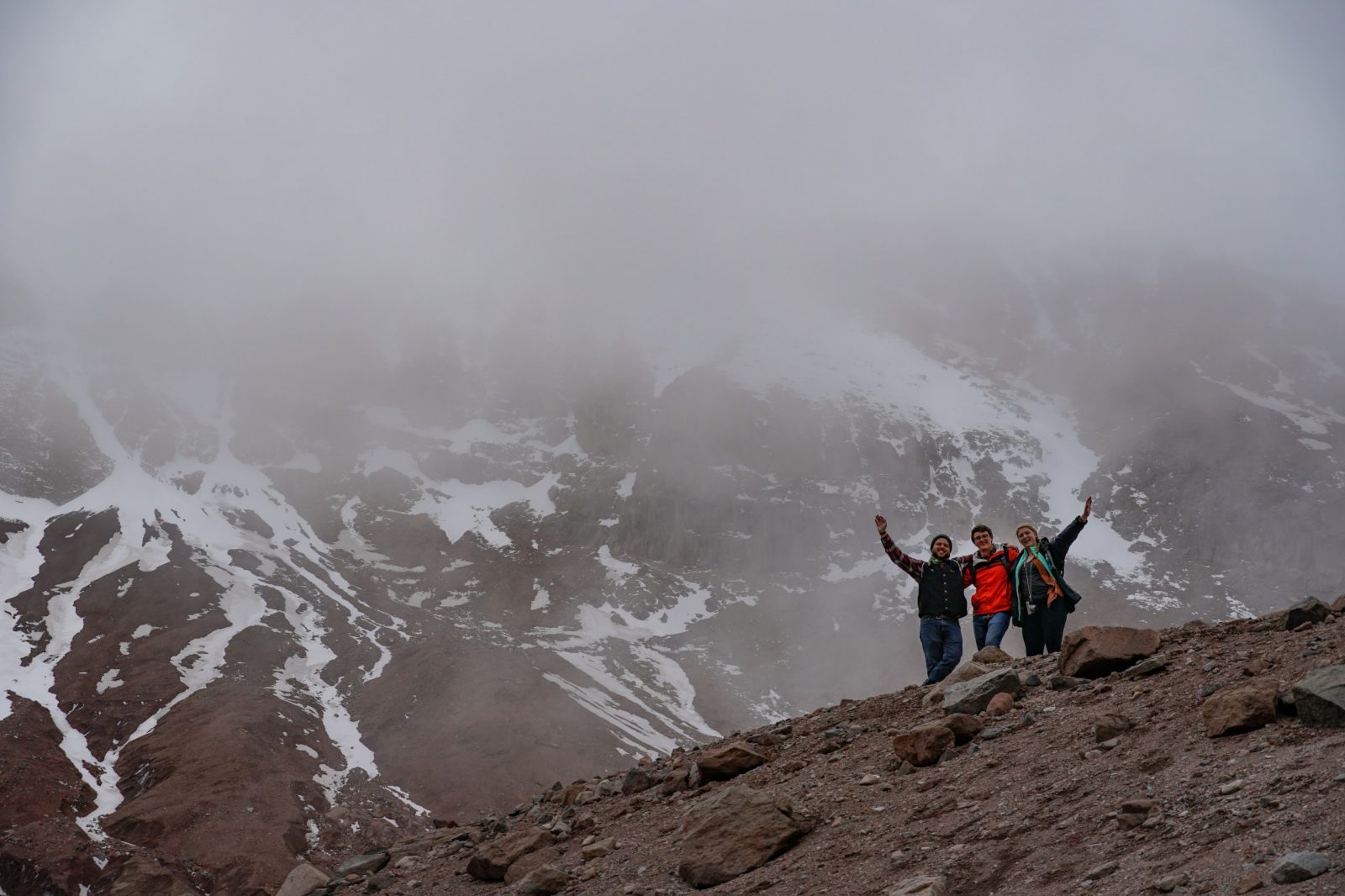 Virginia Tech students celebrate climbing Chimborazo volcano.