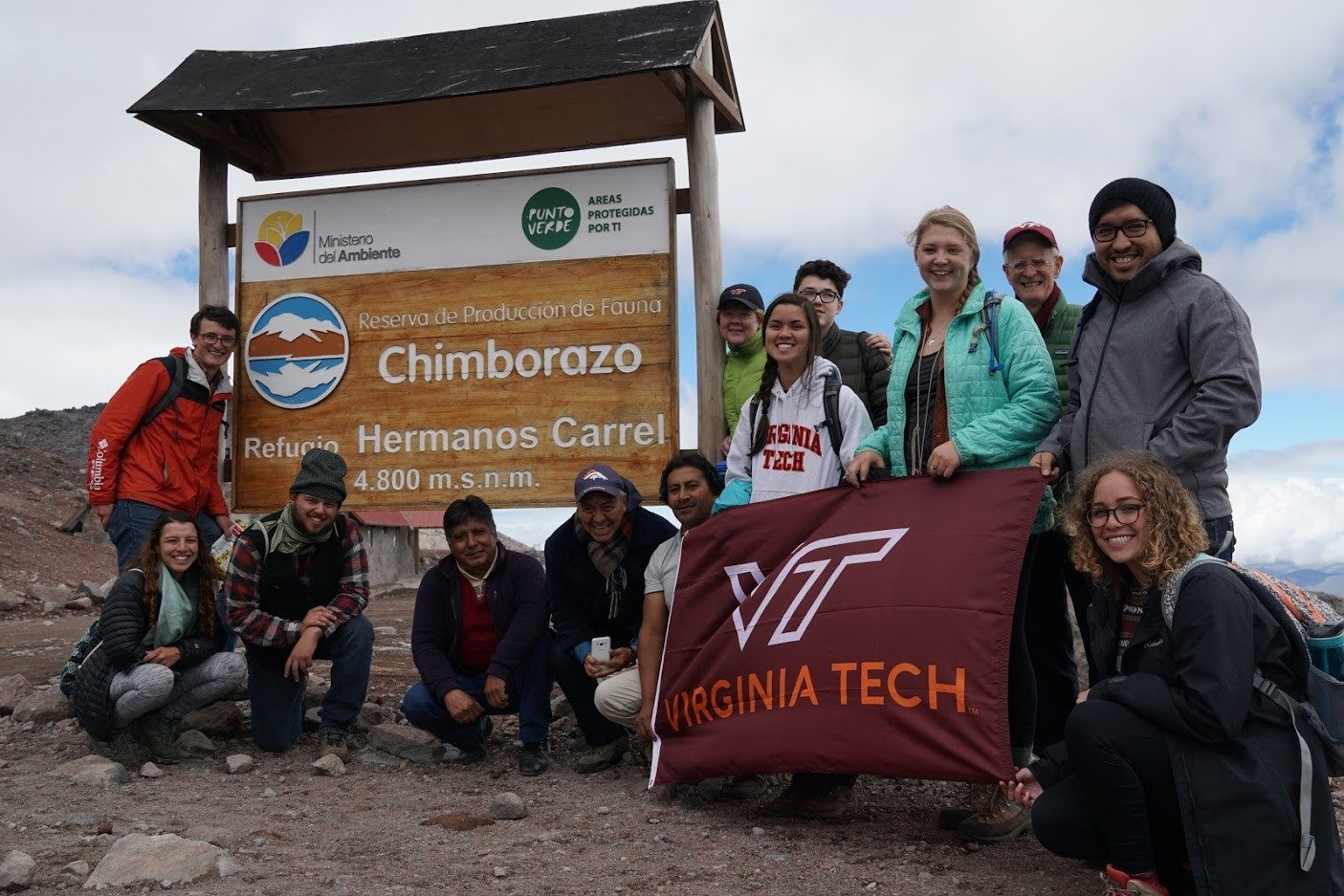 Students display Virginia Tech flag on Chimborazo volcano.