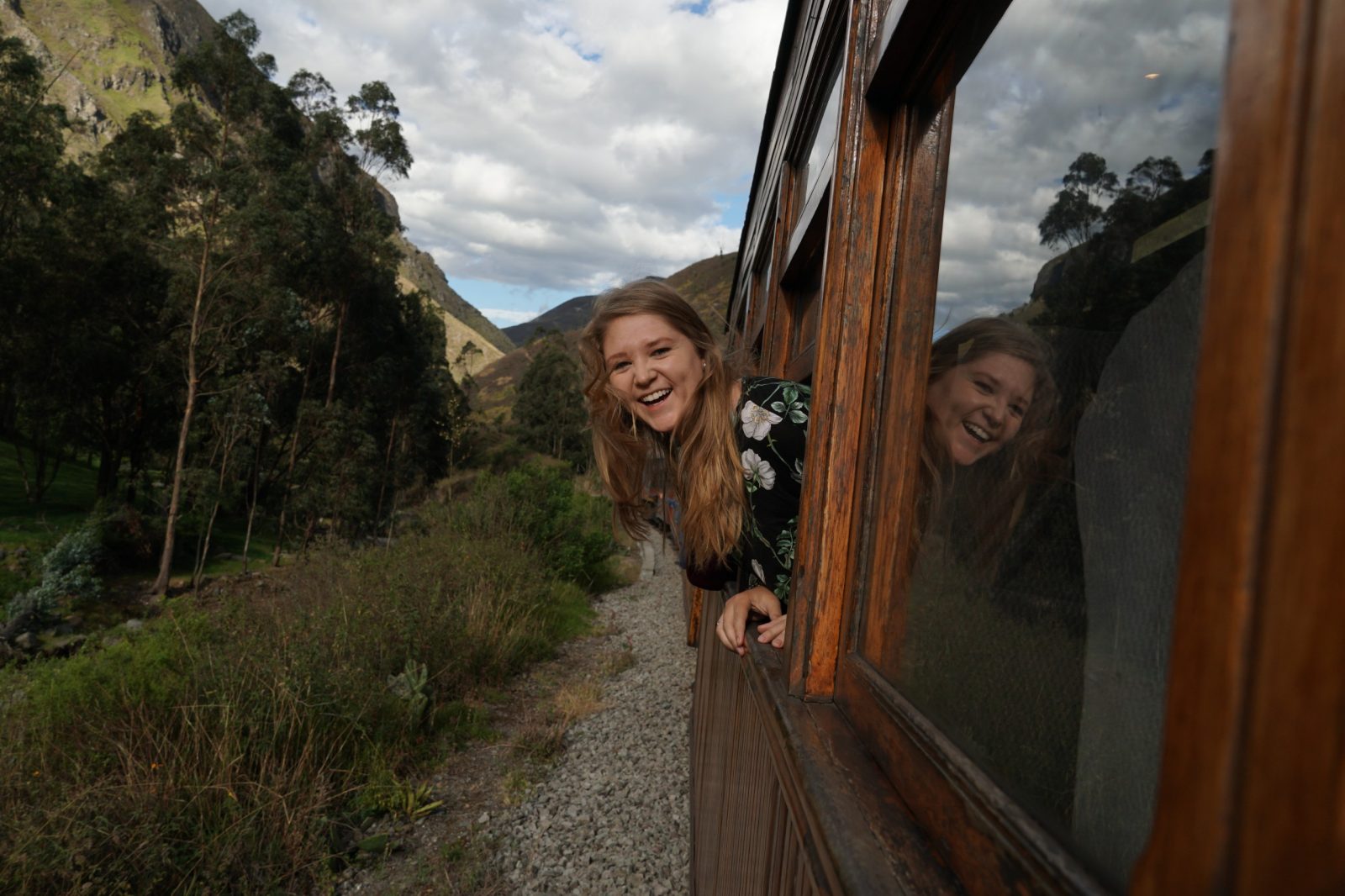 Madi Dynes sticks her head out of a famous train that rounds the Nariz del Diablo in Ecuador.