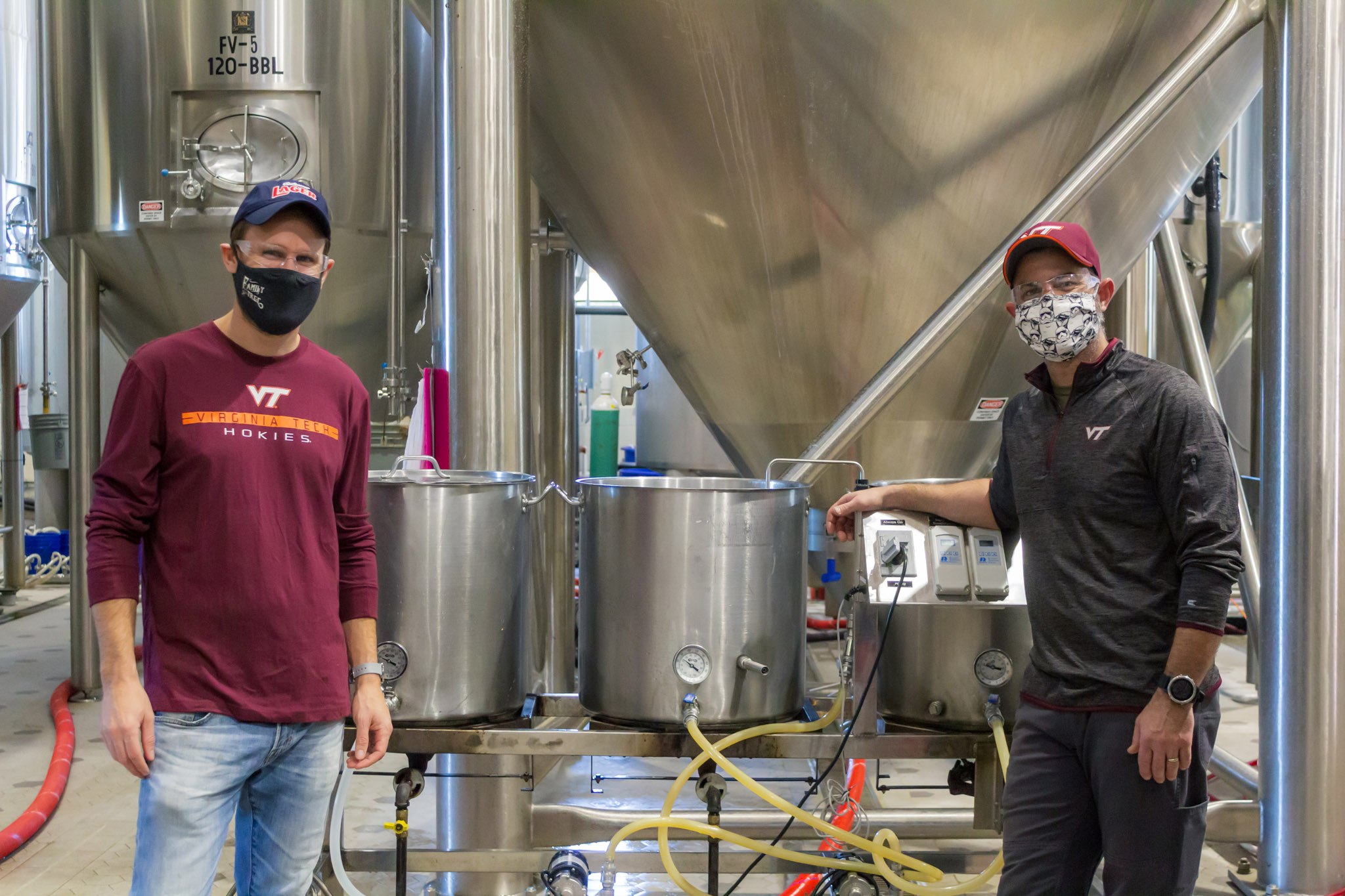 Hardywood Brewmaster Patrick  Murtaugh (left) and Vice President of Production and Head Brewer Brian Nelson, mechanical engineering ‘01, brewing a pilot batch of Fightin’ Hokies Lager. Photo courtesy of Hardywood Park Craft Brewery.