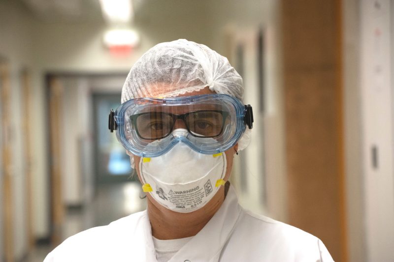 Carla Finkielstein is photographed wearing full PPE gear in summer 2020 as she was setting up a COVID-19 testing lab.