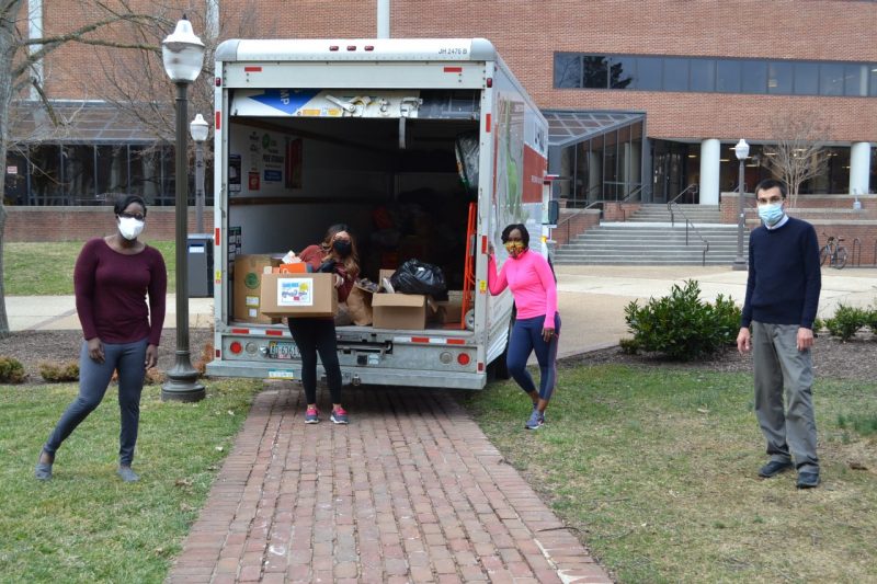 Members of the ORDI office load a van with shoes collected during the Soles4Souls drive