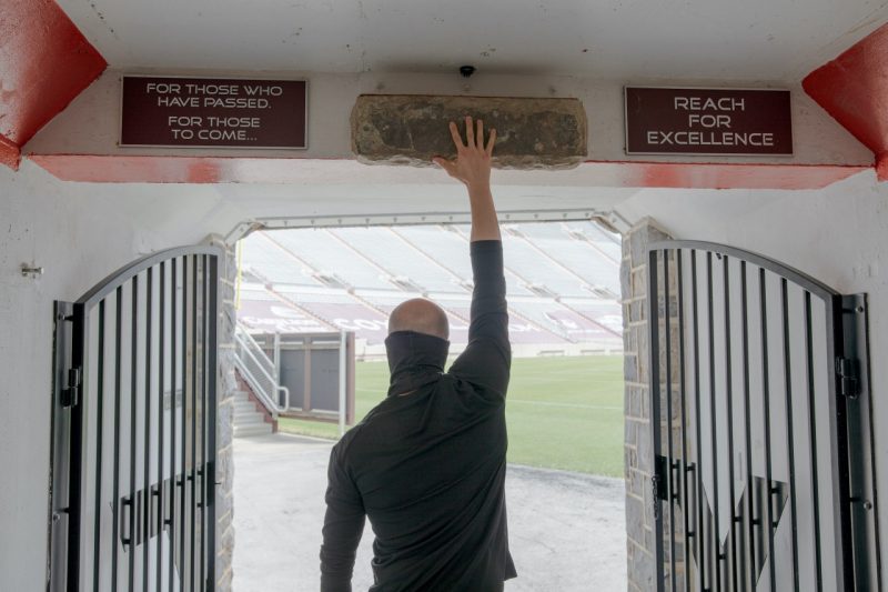 As Marc Lewis touches the Hokie Stone in the Lane Stadium tunnel, he remembers everything he went through to get to this point.