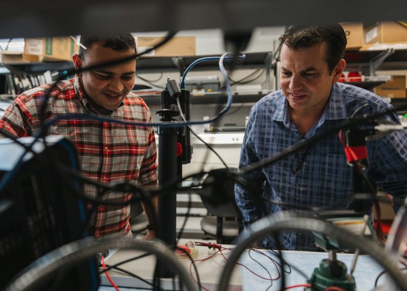 Anand Vadlamani (left), postdoctoral research associate in the Bioelectromechanical Systems Laboratory, conducts research with Rafael Davalos (right). Photo by Spencer Roberts of Virginia Tech.