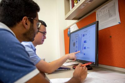 Grad students at lab computer