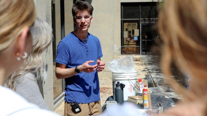 Architecture student Michael Cavicchio teaches a Rockite workshop outside of Cowgill Hall.