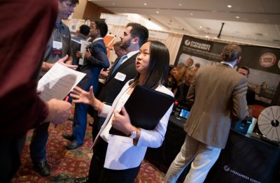 Virginia Tech students talk with employers during a career fair. Photo by Ray Meese.