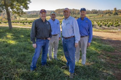 Alumnus Robert Saunders ’86 (third from left) was named the 2022 Swisher/Sunbelt Southeastern Farmer of the Year. Saunders operates Saunders Brothers, Inc., along with his brothers (pictured from left) Jim ‘85, Bennett ‘83, and Tom ‘81. Photo by Tim Skiles for Virginia Tech.