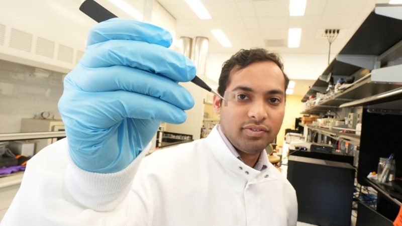 Atharva Agashe views a cellular lattice in the lab of Associate Professor Amrinder Nain.