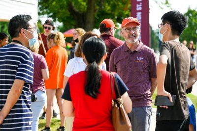 Tim Sands mingles with students on move-in day