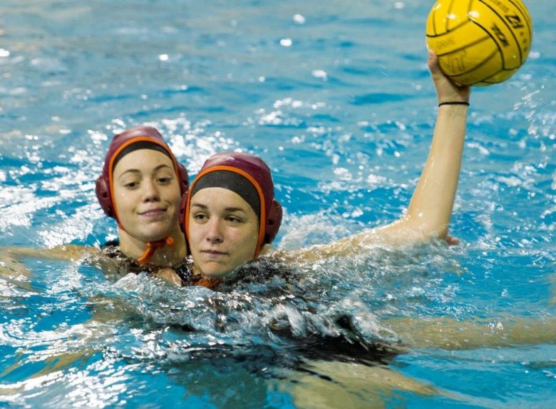 Students play water polo. 