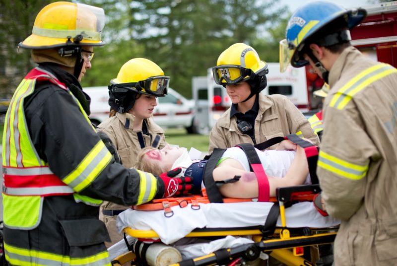 Four members of the Virginia Tech Rescue Squad attend to a mock patient. 