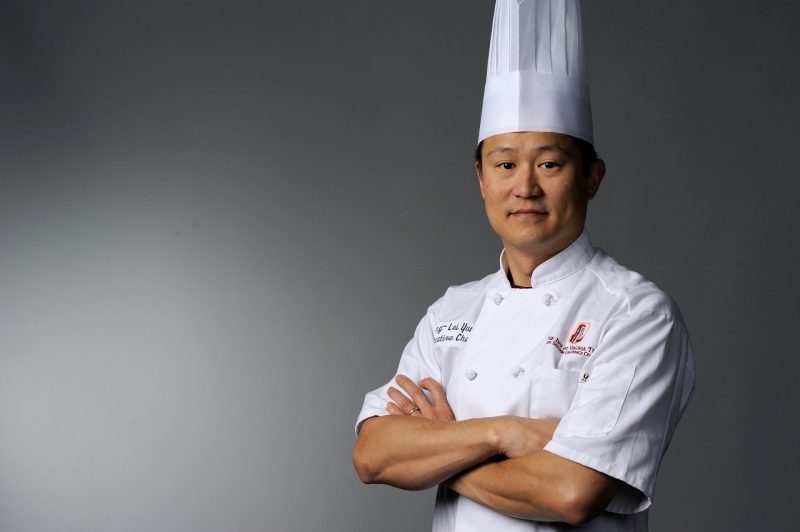 Chang-Lei Yun, the new executive chef at Preston's, standing with arms crossed
