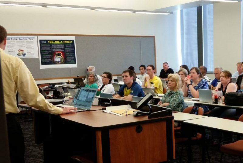 Teachers attend a class on cybersecurity planning and education. 