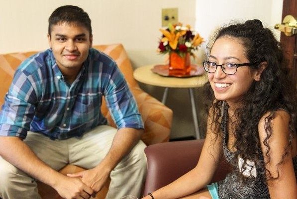 Two students pictured at a welcome reception.