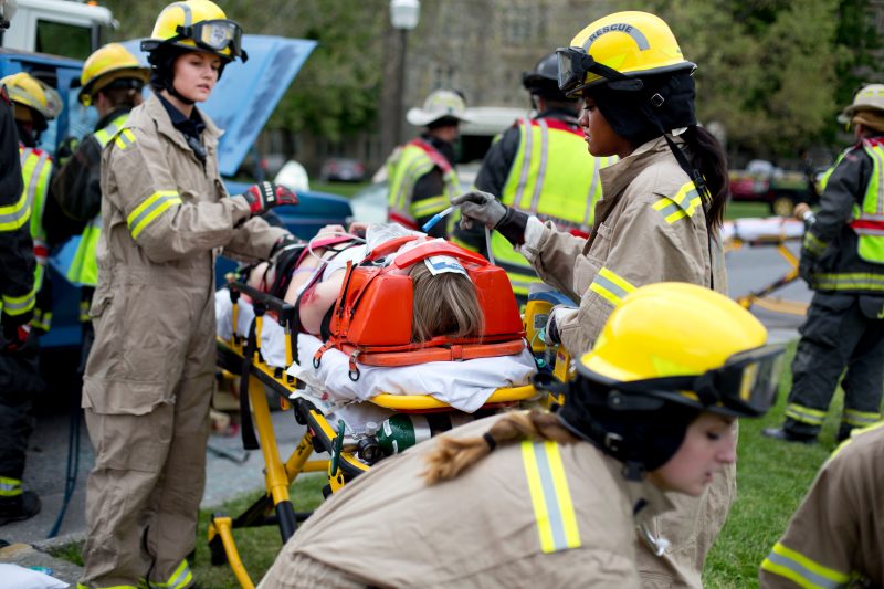 The Virginia Tech Rescue Squad, Virginia Tech Police Department, and Blacksburg Fire and Med-Evac helicopter respond to a simulated crash on the Drillfield to help raise awareness of the dangers of driving under the influence of drugs and alcohol.