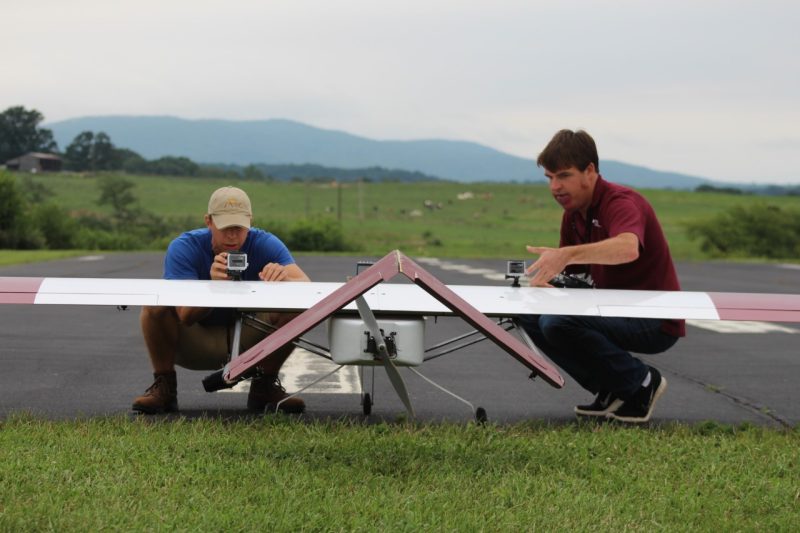Mid-Atlantic Aviation Partnership pilots check video cameras attached to a fixed-wing UAS