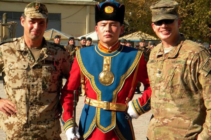 U.S. Army Lt. Col. Mike Rembold, at right, poses for a picture with German Major Olaf Balenseifer and a Mongolian guard at Camp Eggers in Kabul, Afghanistan.