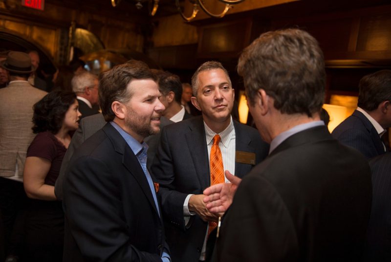 Alumni John Kinzer (left) and Anthony Beverina network at a reception in New York in April.