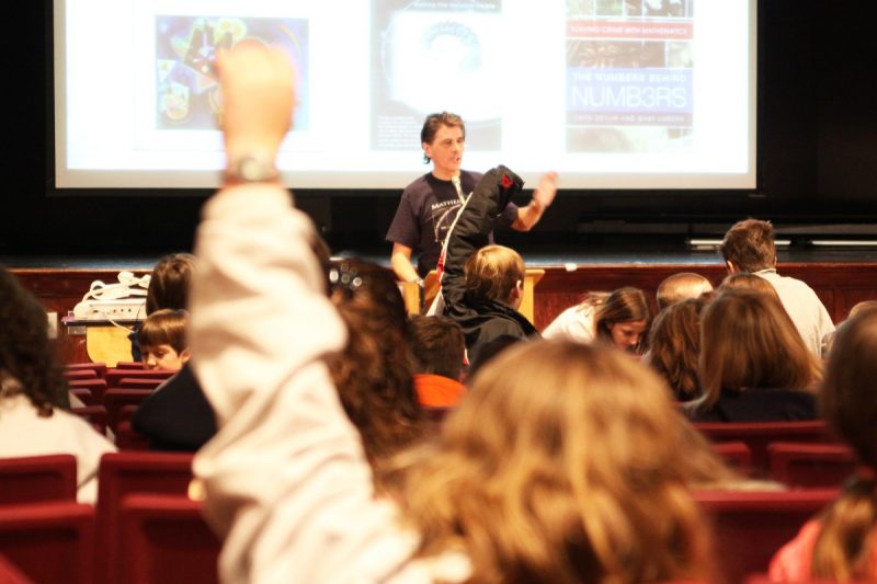 Grade-schoolers participate in a Kids' Tech University presentation
