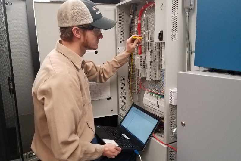 Building Automation System Technician Makenzie Mabe validates sensor readings to ensure the university's energy systems are operating as efficiently as possible.