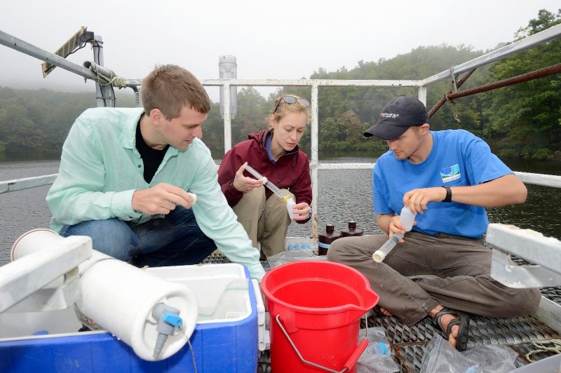 Cayelan Carey samples water with graduate students at Falling Creek reservoir