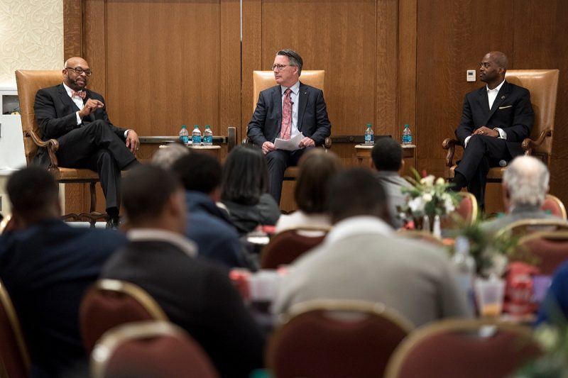 Radford University President Brian Hemphill (left) and  West Virginia State University President Anthony Jenkins (right) speak during a panel discussion moderated by university President Tim Sands.