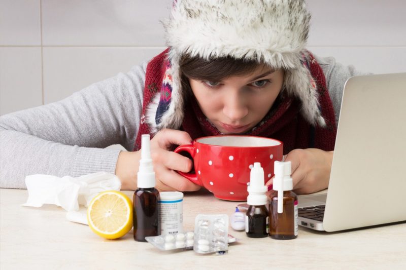 woman samples various flu treatments