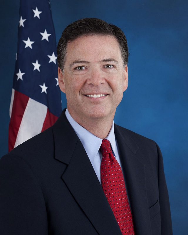 Image of James Comey in front of American flag 