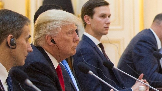 Image of President Trump listening to translator