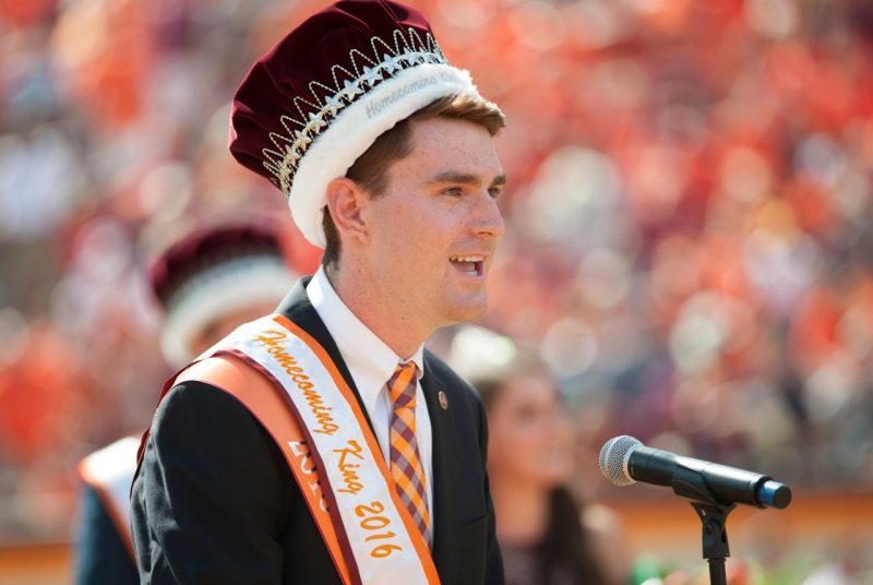 Pat Finn wears his Homecoming crown while addressing the crowd in Lane Stadium.