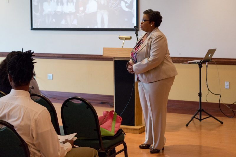 Jody Thompson Marshall, director of the Multicultural Academic Opportunities Program, addresses a group of undergraduate students who participated in the program's Summer Research Internship.