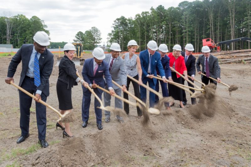 Ten people, including the six speakers of the groundbreaking ceremony, participate in the ceremonial dig.