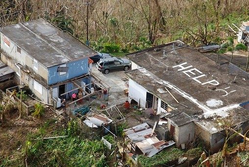 While conducting search and rescue in the mountains of Puerto Rico a U.S. Customs and Border Protection Air and Marine Operations Black Hawk located this home a half mile from its peek with HELP painted it is roof.